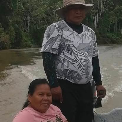Missionaries traveling by boat through the Panama jungle river to reach remote villages
